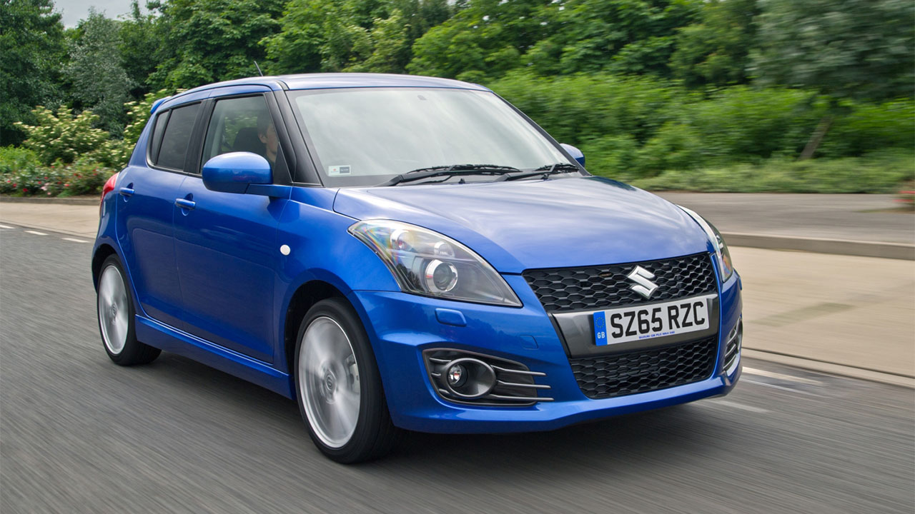 blue suzuki swift sport driving