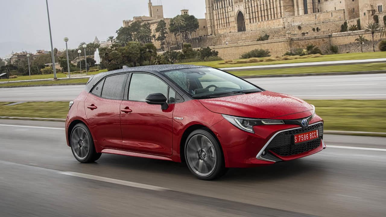 Red Toyota Corolla Exterior Driving Front