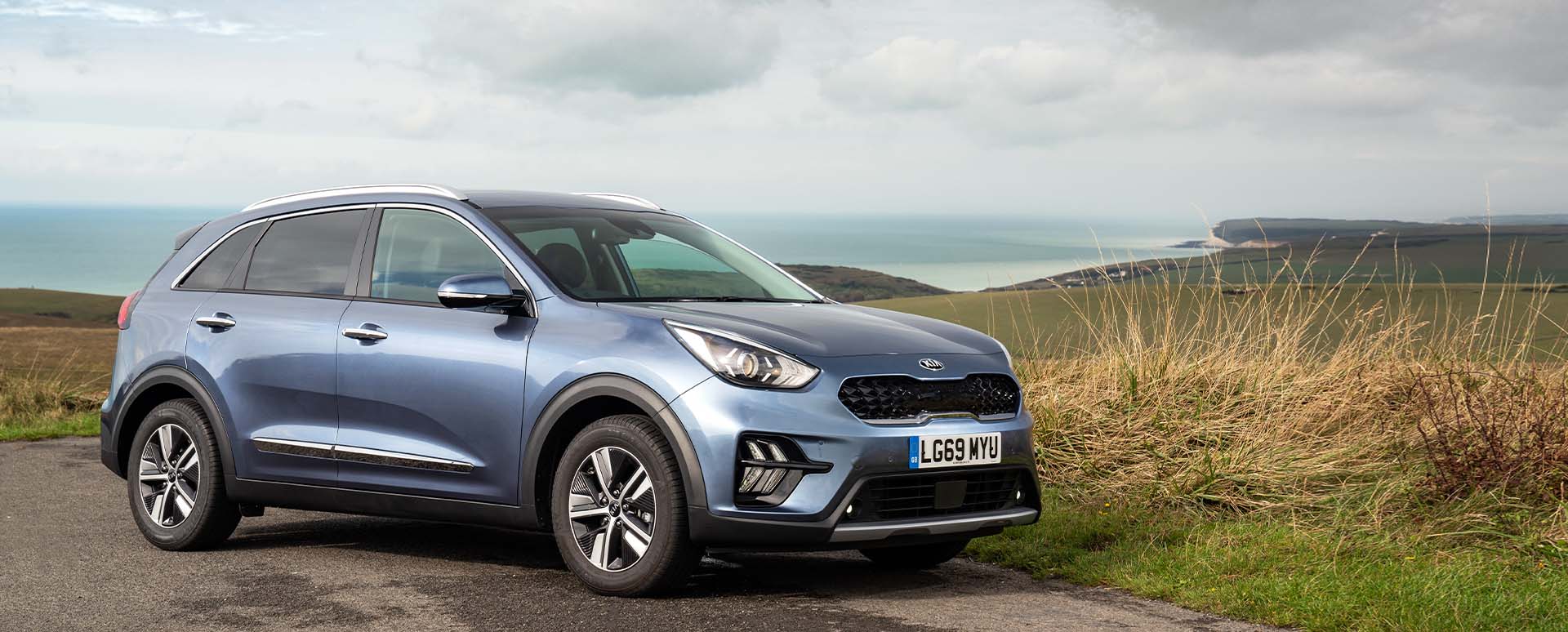 Kia Niro, parked in the countryside