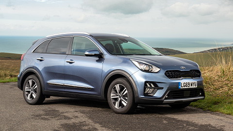 Kia Niro, parked in the countryside