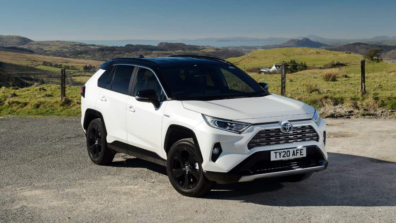 White Toyota RAV4 Hybrid with a black roof