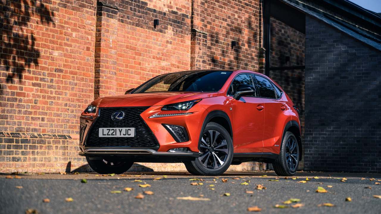 Orange Lexus NX front right brick background