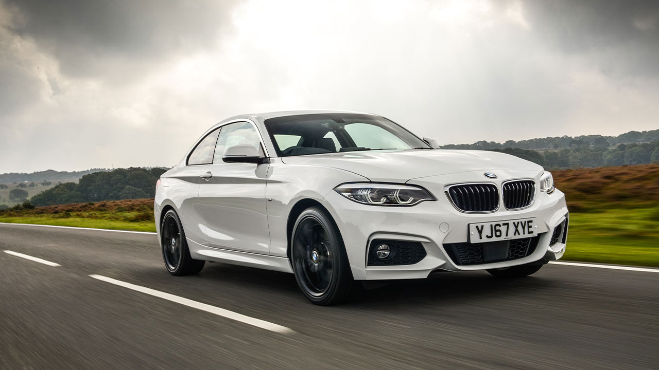 White BMW 2 Series, driving