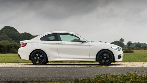 White BMW 2 Series, side profile