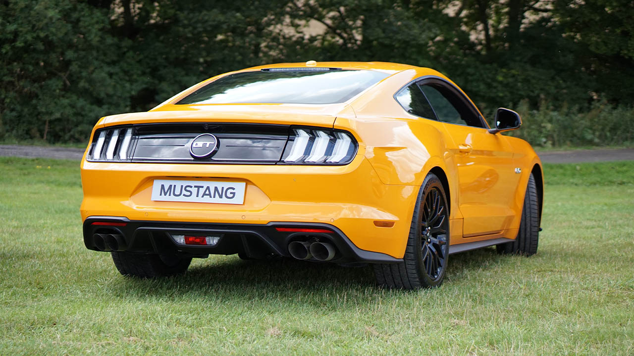 Yellow Ford Mustang, parked