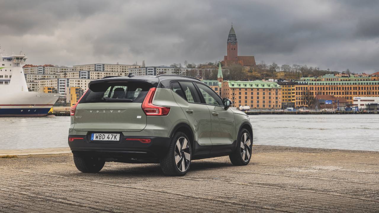 Green Volvo XC40 parked near river