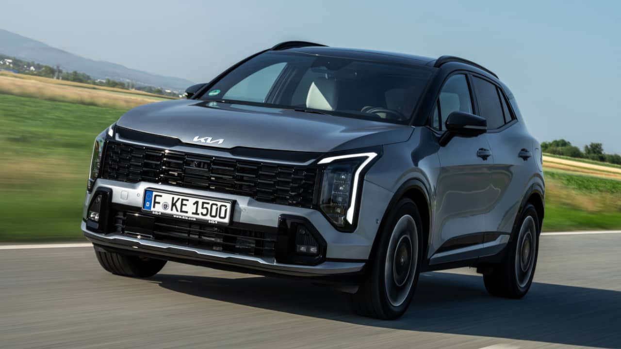 Kia Sportage Driving on Road front Angle