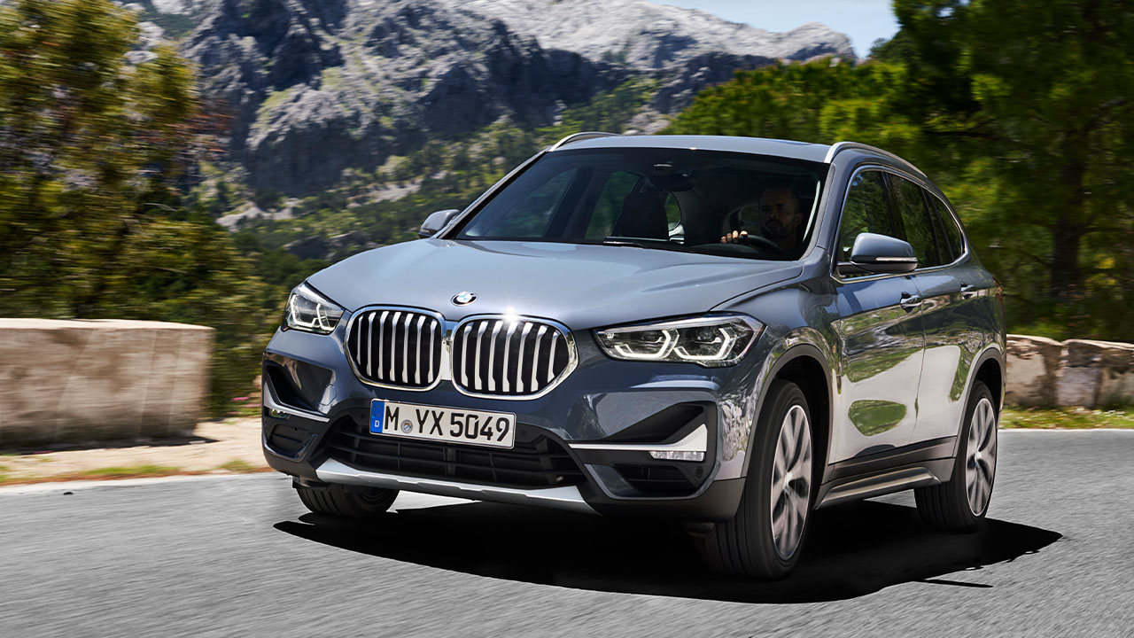 Grey BMW X1, driving