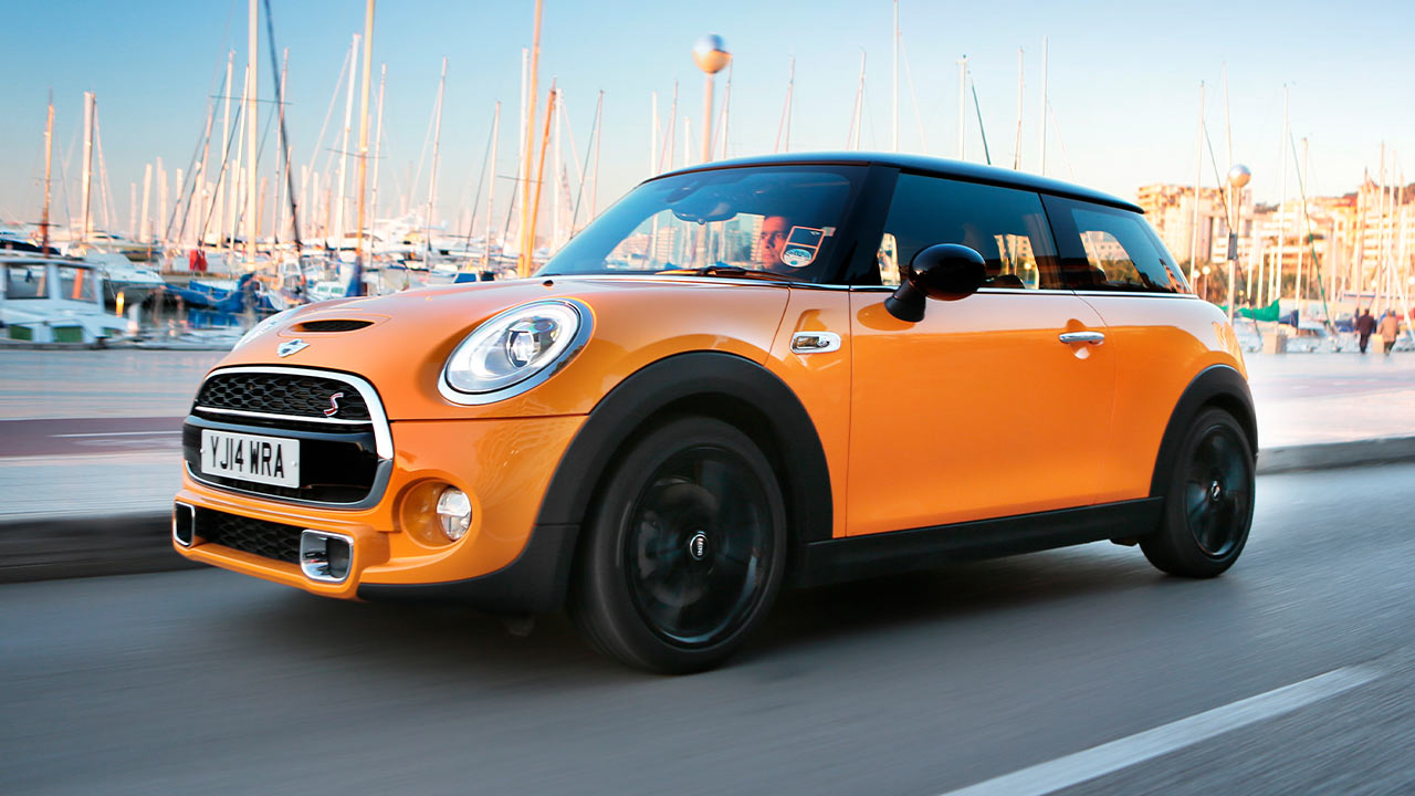 Orange MINI Cooper S, driving