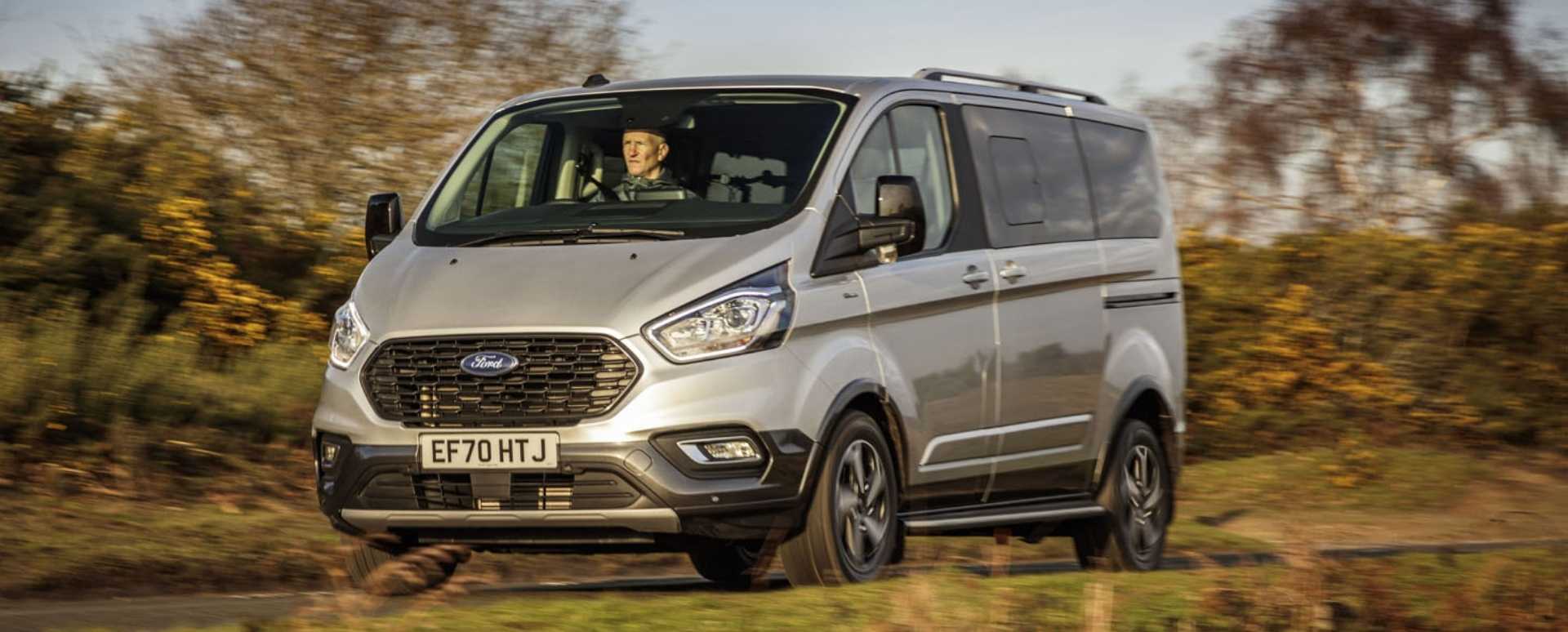 Silver Ford Transit in the countryside