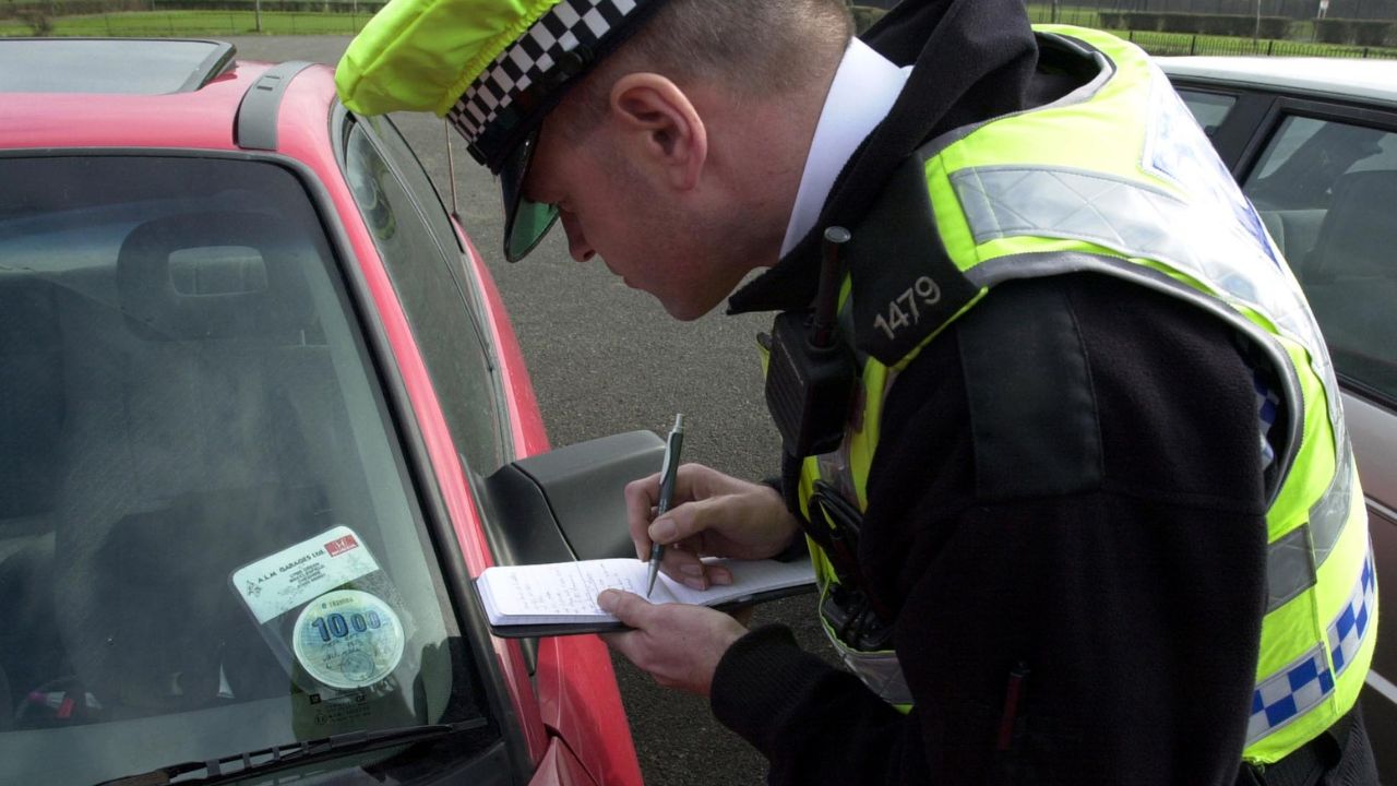 Police officer issuing a ticket