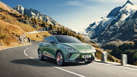 Green car in the highway