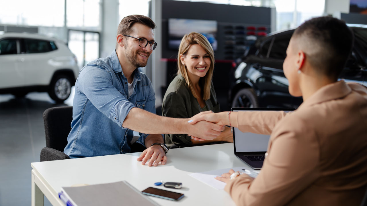 Two men shaking hands after closing a deal