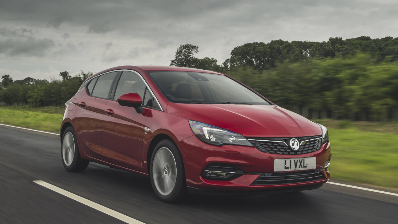 Red Vauxhall Astra, driving