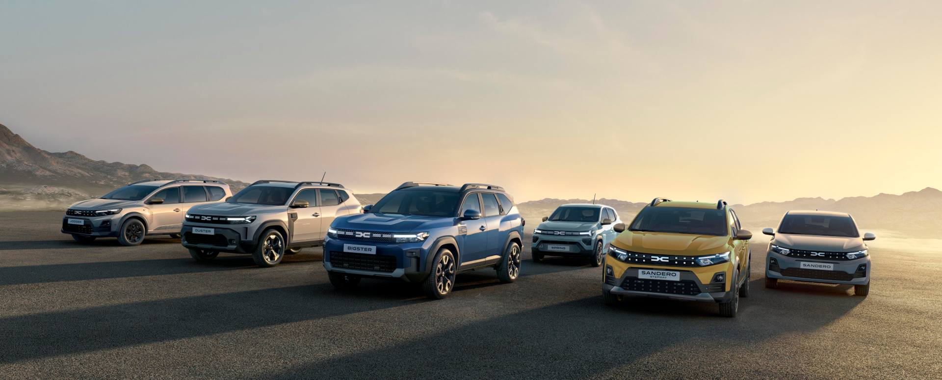Dacia range driving at sunset