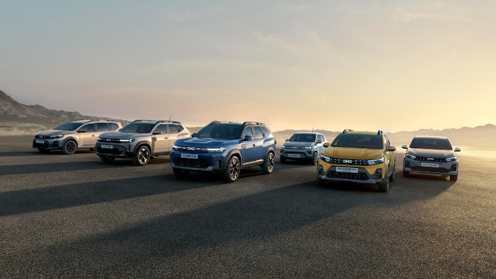 Dacia range driving at sunset