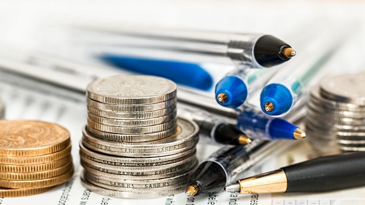 Coins and pens on top of a document