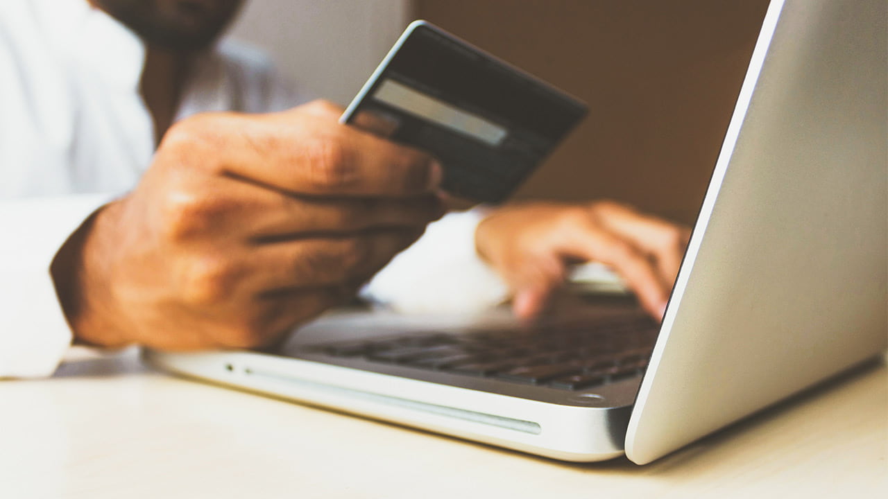 Someone doing online shopping on a laptop