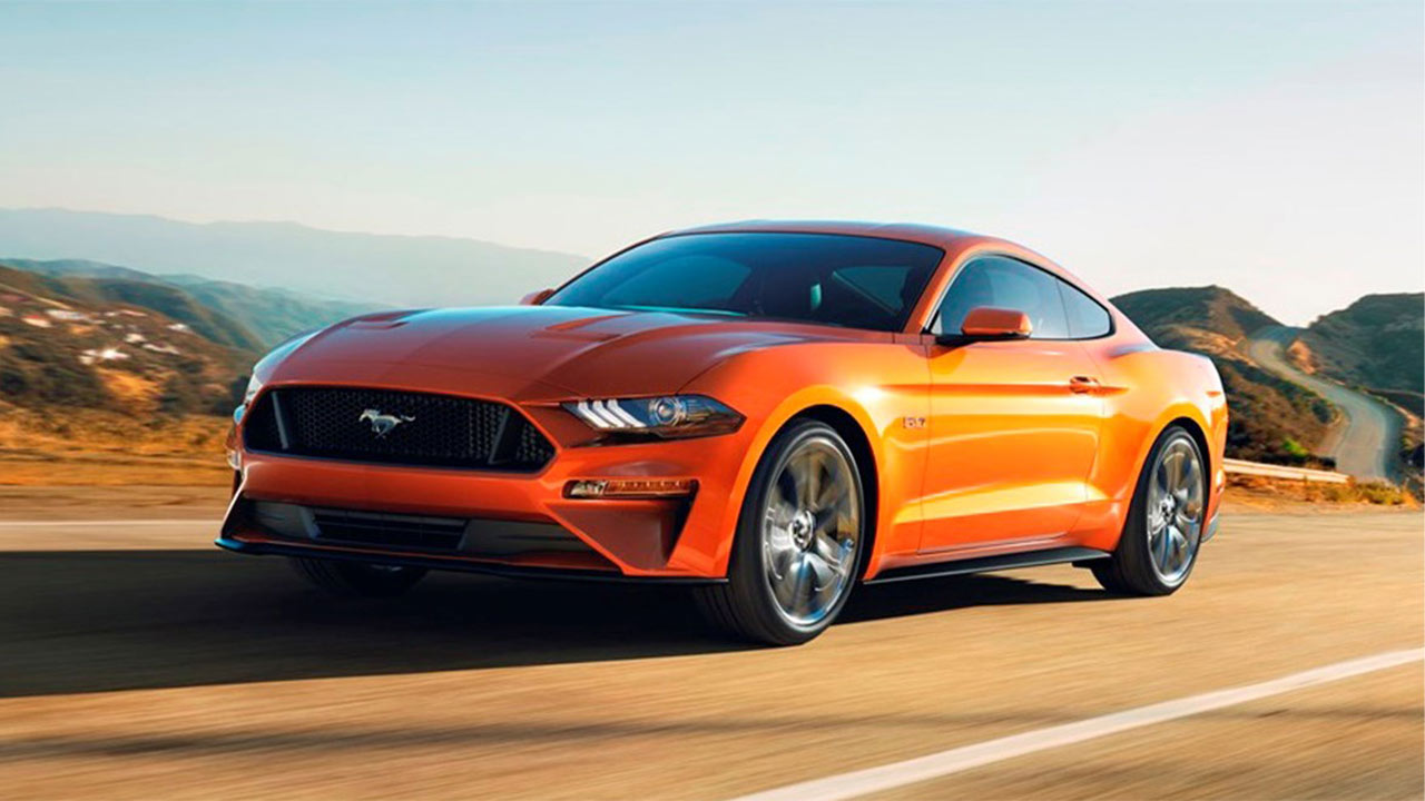 orange ford mustang, front quarter, driving