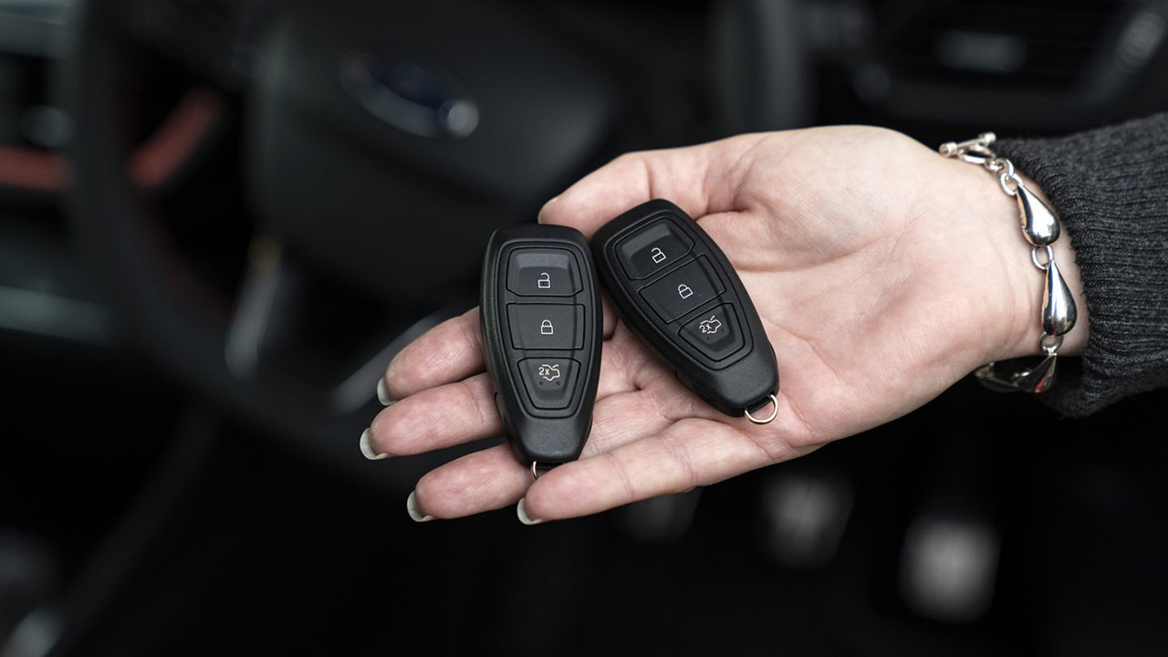 Woman holding a set of car keys