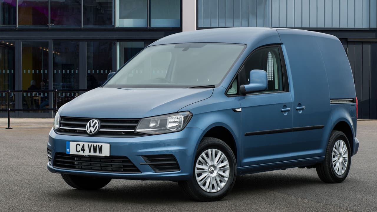 VW Caddy in Blue Parked