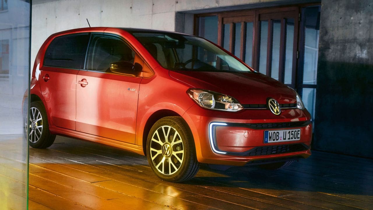 Red Volkswagen up! parked in a garage