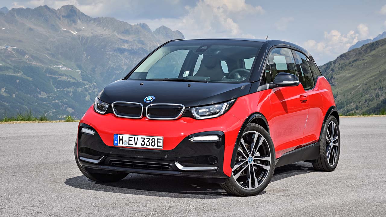 Two-tone BMW i3S, parked with hillside background