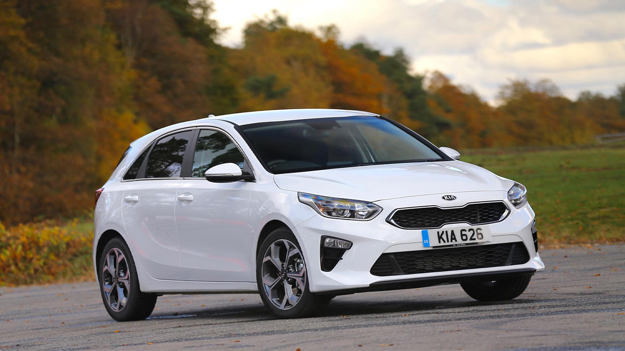 White Kia Ceed, driving in countryside