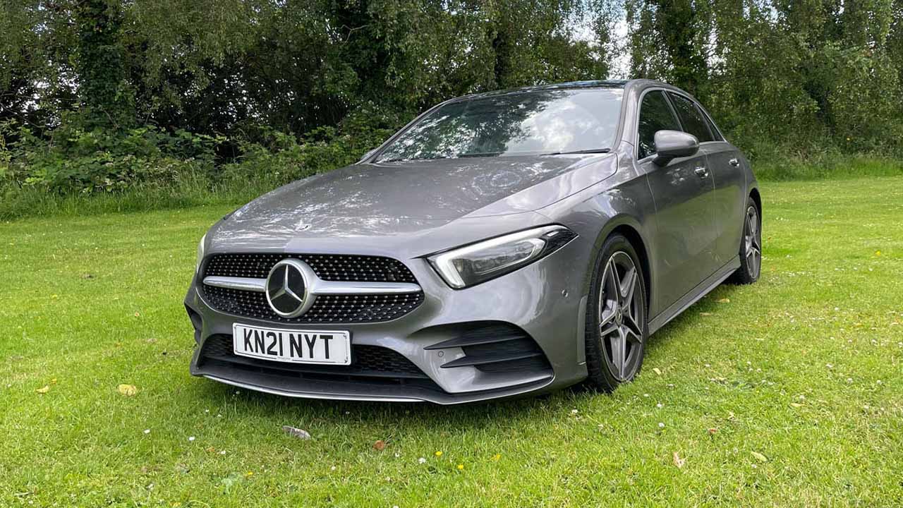 Grey Mercedes-Benz A-Class, parked in city park on grass