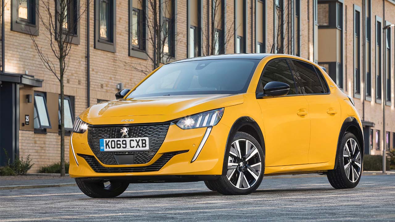 Yellow Peugeot 208, parked in urban environment