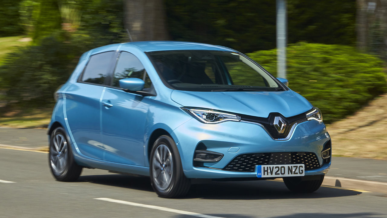 Blue Renault Zoe, driving in village