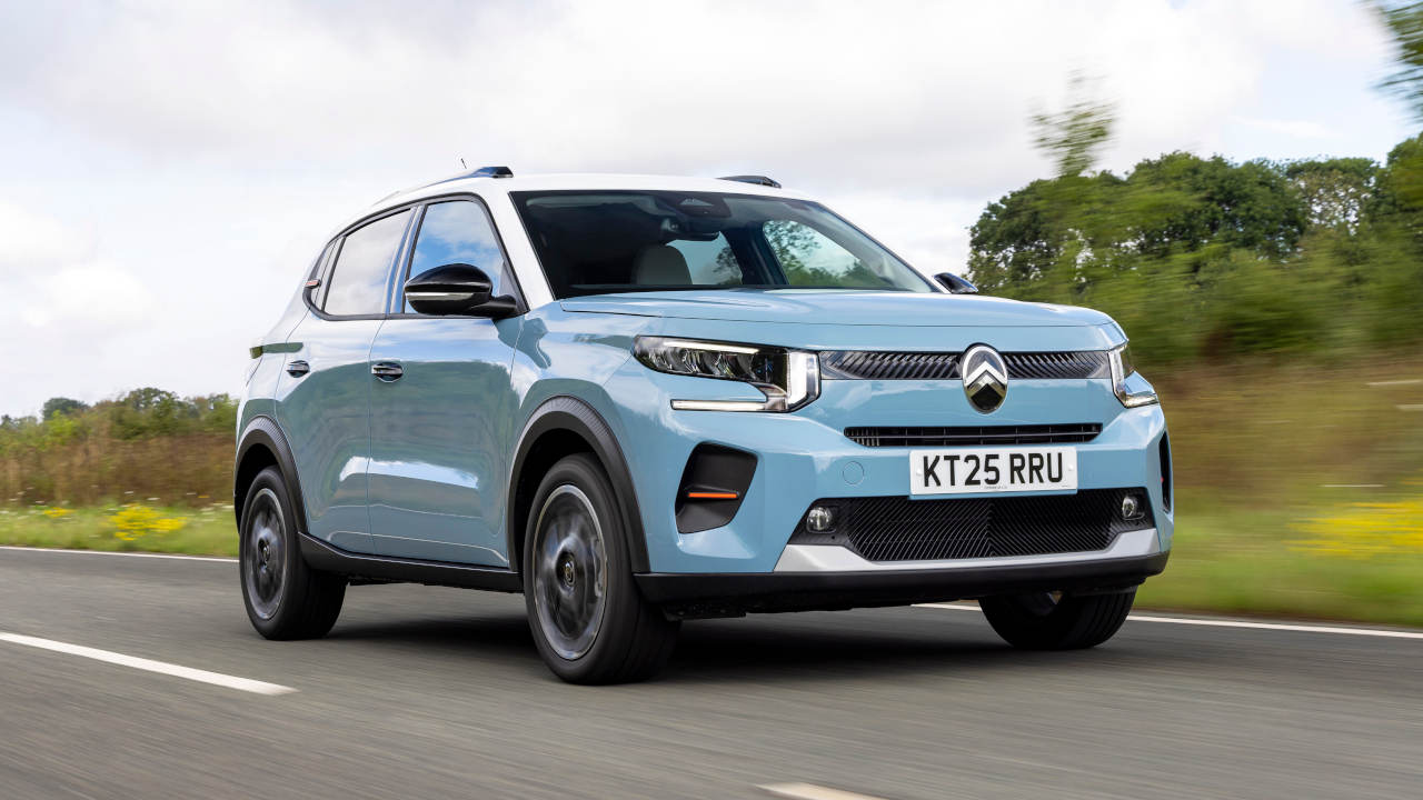 Blue Citroen C3 Driving On Road