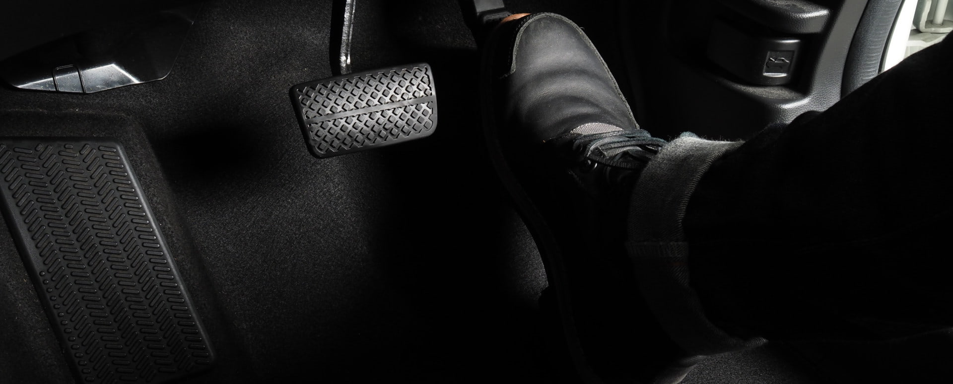 Foot on Car Accelerator Pedal