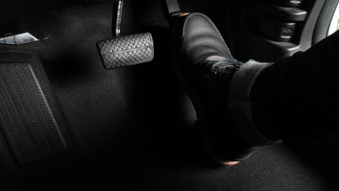 Foot on Car Accelerator Pedal