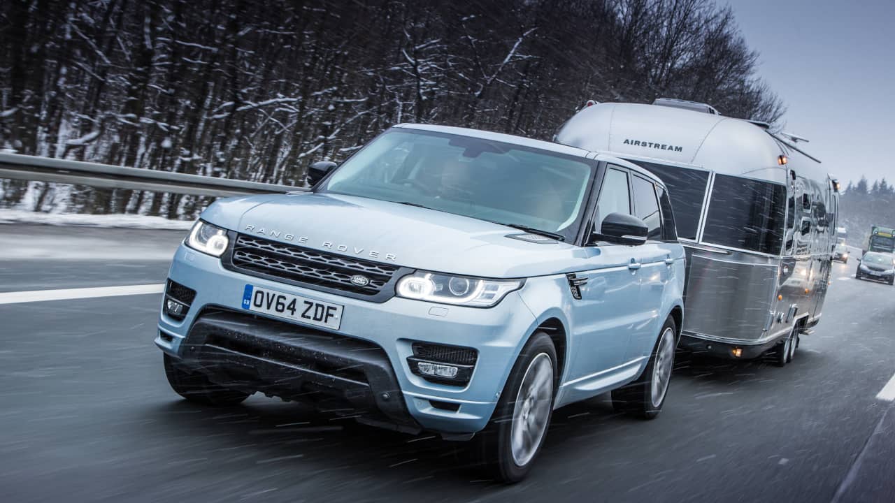 Range Rover Towing Caravan in Snow