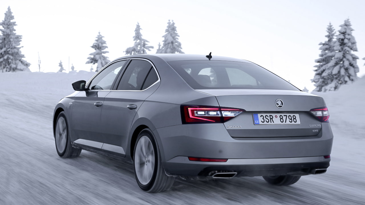 Silver Skoda Superb Winter Driving