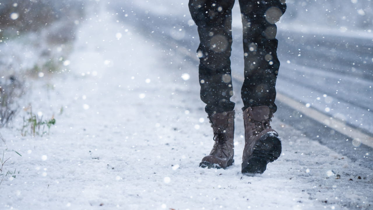 Winter Boots Walking on Road