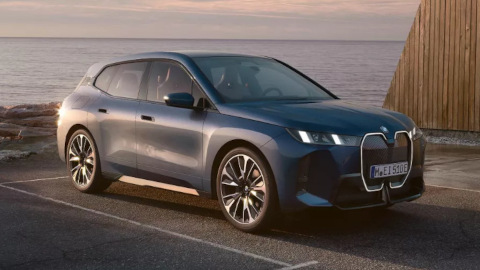 BMW iX Parked in Bay in Front Of Sea