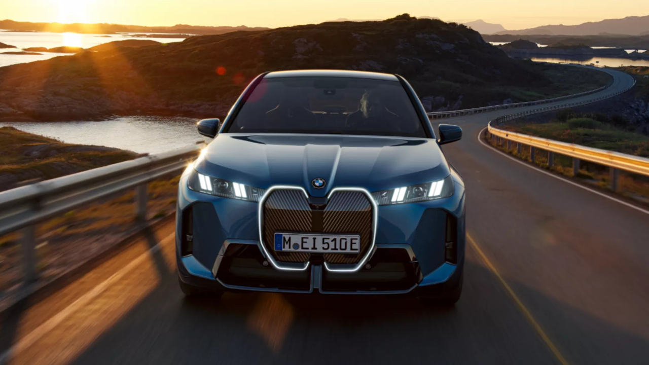 Blue BMW iX Front On Driving