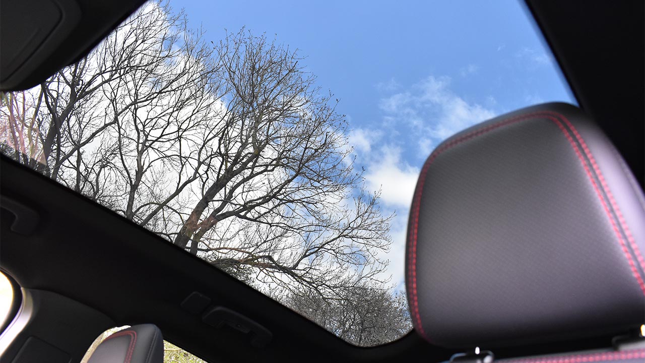 ford mustang mach-e, parked in countryside, panoramic sunroof