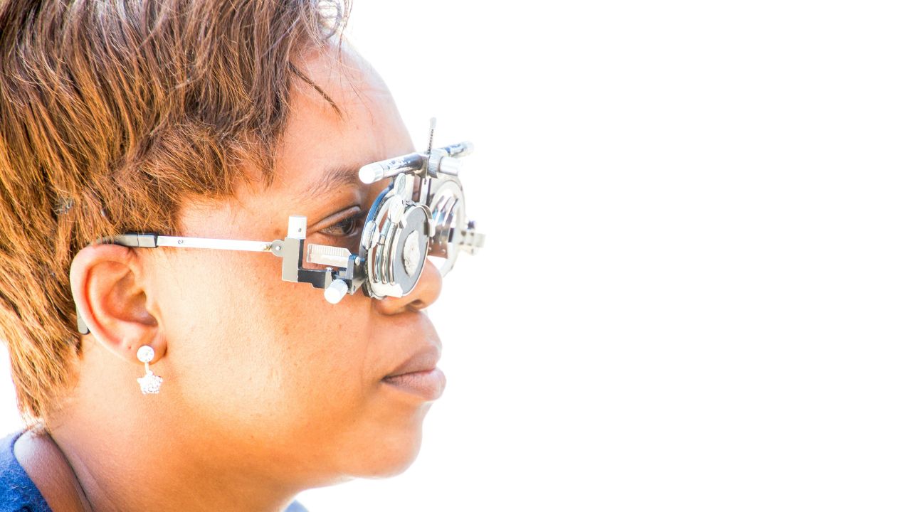 Woman with an eye test machine placed on her eyes