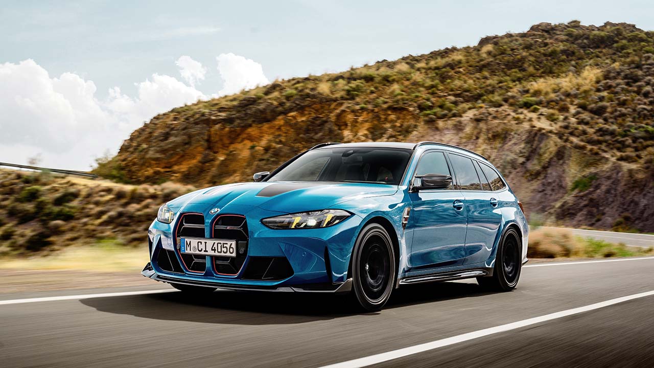 Blue BMW M3 Touring CS Exterior Front Driving in Countryside