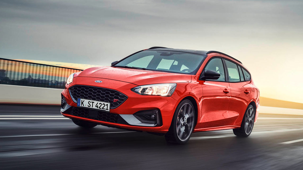 Red Ford Focus ST Exterior Front Driving on Coastal Road