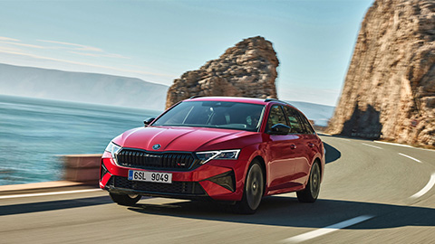 Red Skoda Octavia vRS Estate Exterior Front Driving on Coastal Road