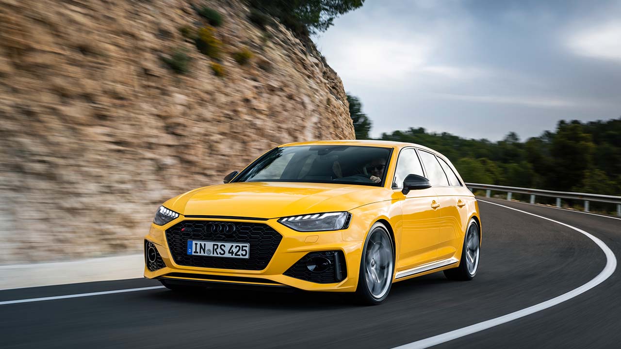 Yellow Audi RS4 Avant Exterior Front Driving on Valley Road