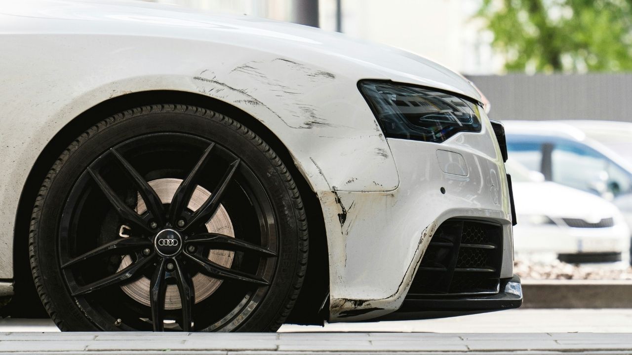 White car scratched in the bumper area
