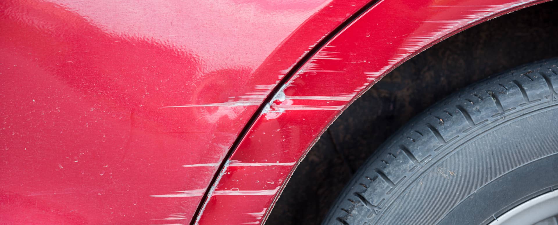 Scratches on Red Car