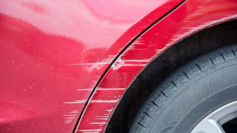 Scratches on Red Car