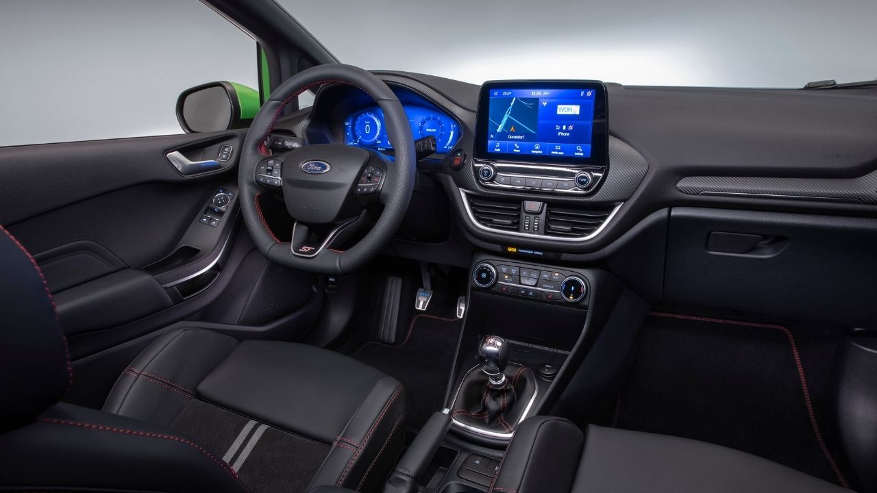 Inside of Ford Fiesta's Cabin. View to the steering wheel and infotainment system.