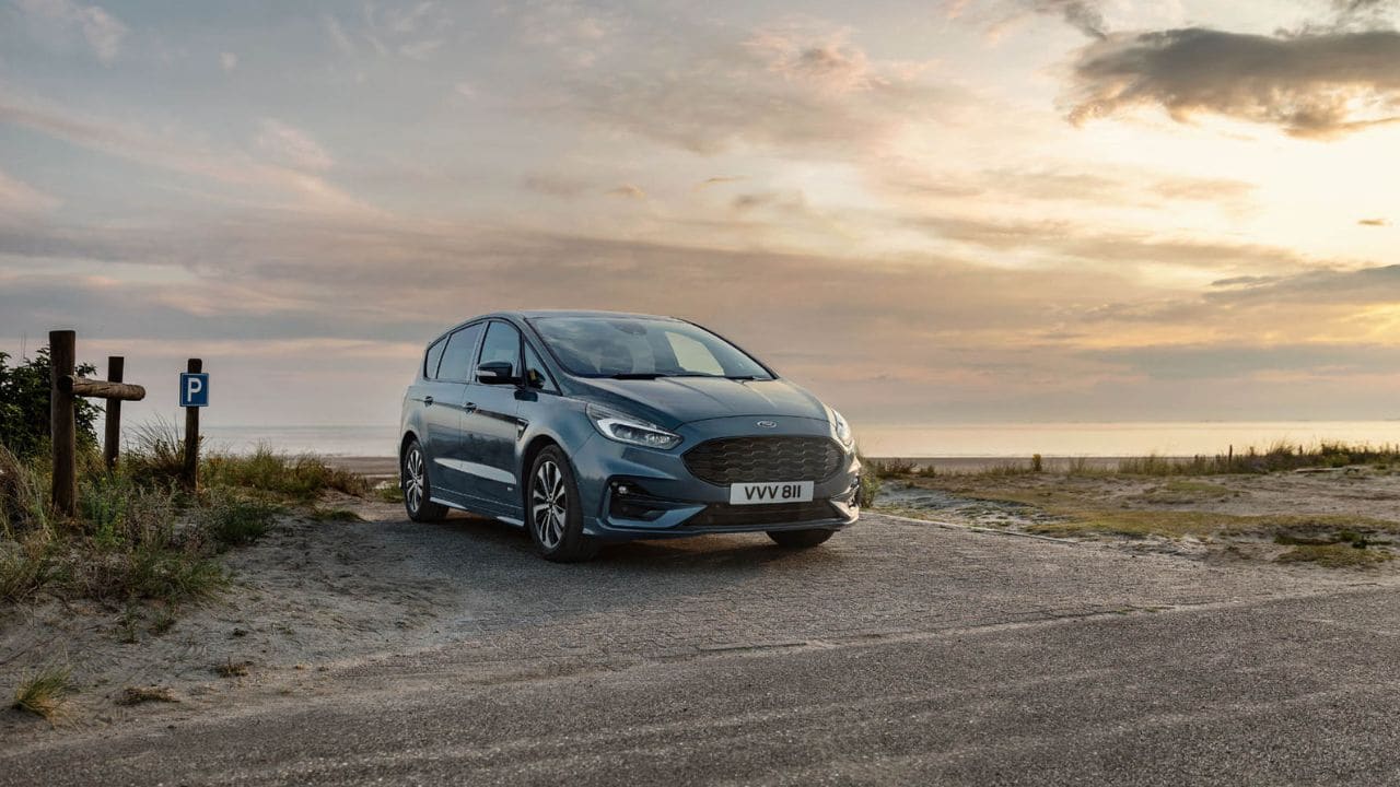Blue Ford S-Max parked on the hard shoulder of a motorway